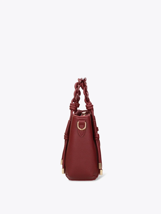 Pebbled Leather Handbag With Braided Top Handle And Knotted Side Details For Chic Style